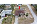 Aerial view of the home featuring a fenced backyard and screened in pool at 1034 Aladdin Rd, Spring Hill, FL 34609