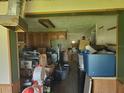 View of a kitchen space with clutter at 5821 Michigan Ave, New Port Richey, FL 34652