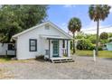 Attractive single-story home features a teal door and tidy front yard at 7252 Coventry Ct, Weeki Wachee, FL 34607