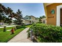 Lawn with manicured landscaping enhances the curb appeal of this inviting home at 8604 Corinthian Way, New Port Richey, FL 34654