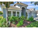 Well-maintained lawn and landscaping complement this charming single-story home at 8635 Creedmoor Ln, New Port Richey, FL 34654