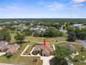 Overhead view of a single-Gathering home in a quiet community with well-maintained lawns at 9208 Butler Blvd, Weeki Wachee, FL 34613