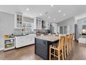 Bright kitchen with large island, stainless steel appliances, and white cabinetry at 14105 Agua Clara Dr, Hudson, FL 34667