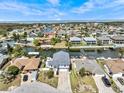Aerial view of the home in a waterfront neighborhood, conveniently located on a canal at 15535 Allmand Dr, Hudson, FL 34667