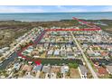 Aerial view showcasing waterfront property and waterway access to the bay with a clear path at 15535 Allmand Dr, Hudson, FL 34667