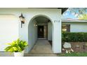Arched entry with manicured landscaping at 2116 Karan Way, Clearwater, FL 33763