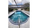 Covered outdoor pool with clear blue water, great for swimming laps and relaxing at 273 Gulfport Ln, Spring Hill, FL 34608