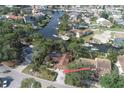 Aerial shot of the property showcasing its location on a canal in a waterfront community at 4328 Marine Pkwy, New Port Richey, FL 34652
