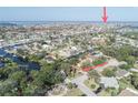 Expansive aerial view showing the home's location within a waterfront neighborhood near open water at 4328 Marine Pkwy, New Port Richey, FL 34652