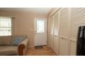 Inviting entryway with a decorative door, closet, and views of the living area at 5031 Essex Ln, Spring Hill, FL 34606