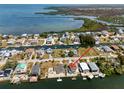 Aerial view of a coastal neighborhood with waterfront homes and canals at 6622 Seaview Blvd, Hudson, FL 34667