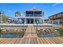 Waterfront home with a private dock and spacious outdoor entertainment area at 6622 Seaview Blvd, Hudson, FL 34667
