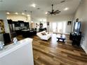 Bright living room featuring wood floors, recessed lighting, a ceiling fan, and an open layout at 9089 Dupont Ave, Spring Hill, FL 34608