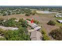 Aerial view of neighborhood near a pond, highlighting the property's prime location at 11241 Dollar Lake Dr # 5, Port Richey, FL 34668