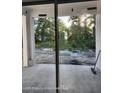 Patio view with sliding glass doors and a view of the backyard landscape at 12331 Fulmar Rd, Weeki Wachee, FL 34614
