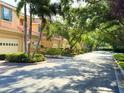 Picturesque street view with manicured lawns and mature trees creating a tranquil setting at 3655 Square West Ln # 9, Sarasota, FL 34238