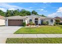 Charming single-story home with manicured lawn and well-maintained landscaping at 4080 Gevalia Dr, Brooksville, FL 34604