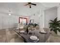 Open-concept dining area with ample seating, chandelier, and view into the adjacent living area at 4335 Duval St, Spring Hill, FL 34606