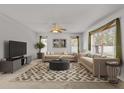 Bright living room featuring modern decor, comfortable seating, and a stylish patterned rug at 4335 Duval St, Spring Hill, FL 34606