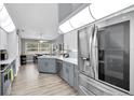 Spacious kitchen featuring stainless steel appliances, recessed lighting, and eat in dining area at 5638 Hereford Dr, New Port Richey, FL 34655