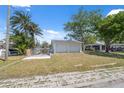 Detached two-car garage with a boat launch and canal access, offering convenient waterfront living at 6521 Boatyard Dr, Hudson, FL 34667