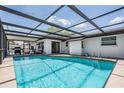 Enclosed pool area with ample sunlight, offering a relaxing outdoor space at 6611 Ridge Crest Dr, Port Richey, FL 34668