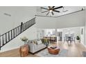 Inviting living space with a view of the modern kitchen and dining area at 7129 Hideaway Trl, New Port Richey, FL 34655