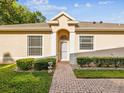 Charming single-story home with a brick walkway and well-maintained landscaping at 7616 Wimpole Dr, New Port Richey, FL 34655
