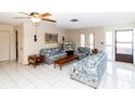 Comfortable living room with tile flooring and plenty of natural light at 7715 Gulf Highlands Dr, Port Richey, FL 34668