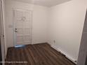 Bright room featuring new wood-look flooring and a freshly painted interior at 12116 Lamont Dr, Spring Hill, FL 34608