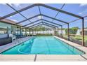 Inviting screened-in pool area with ample space for relaxation and entertainment at 12191 Monarco Ln, Spring Hill, FL 34609