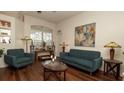 Comfortable living room featuring hardwood floors, bright natural light, and stylish furniture at 3102 Lema Dr, Spring Hill, FL 34609