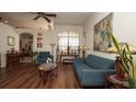 Cozy living room with hardwood floors, ample seating, and a decorative ceiling fan at 3102 Lema Dr, Spring Hill, FL 34609