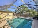 Enjoy Florida living in this inviting screened pool with covered area for relaxation and entertaining at 4934 Amherst Ct, New Port Richey, FL 34652