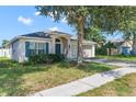 Inviting single-story home with a two-car garage and tidy front yard at 779 Nodding Shade Dr, Brooksville, FL 34604