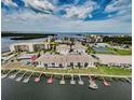 Aerial view of waterfront condos with boat docks and ocean access to nearby beach community at 8210 Aquila St # 218, Port Richey, FL 34668