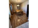 Cozy dining area showcases a wooden table with six chairs and classic wooden floors at 9007 49Th E Ave, Palmetto, FL 34221