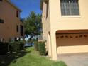 Spacious two car garage with a large side yard, room for a small garden at 1514 Citrine Trl, Tarpon Springs, FL 34689