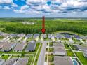 Aerial view of home and surrounding community; the house is located on a quiet street at 15355 Renaissance Ave, Odessa, FL 33556