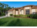 Charming single Gathering home with a well manicured lawn and lovely landscaping at 5931 Precious View Ct, New Port Richey, FL 34655
