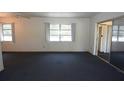 Spacious bedroom featuring sliding glass door closet and natural light at 6327 Skyline Ct, Spring Hill, FL 34606