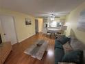 Bright living room featuring hardwood floors and seamless flow into the dining area at 6338 Spring Flower Dr # 15, New Port Richey, FL 34653