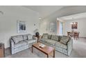 A cozy living room featuring neutral colored couches and a bright airy ambiance at 7644 St Andrews Blvd # 0, Weeki Wachee, FL 34613