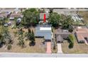 Aerial view of a home with a pool and a well maintained exterior and surrounding landscape at 8522 Inwood Dr, Hudson, FL 34667
