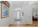 Bright foyer featuring tile flooring, arched entryway and lots of natural light at 10906 New Brighton Ct, New Port Richey, FL 34654