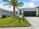 Charming single-story home featuring a beautifully landscaped front yard and well-maintained lawn at 11342 Hollander Ave, Hudson, FL 34667