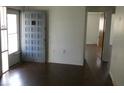 Welcoming entryway with dark hardwood floors and neutral wall color at 3214 Pinon Dr, Holiday, FL 34691