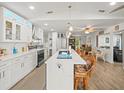 Bright, modern kitchen with an island, stainless steel appliances, and an open floor plan at 4128 Camelia Dr, Hernando Beach, FL 34607