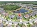 Aerial view of the home showcasing its location on a cul-de-sac with a pond view at 4188 Barbour Trl, Odessa, FL 33556