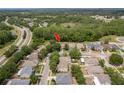 Birds eye view of the property showing its location near the green space and roadways at 6125 Desert Peace Ave, Land O Lakes, FL 34639